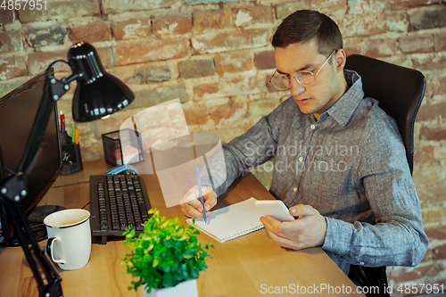 Image of Man working from home during coronavirus or COVID-19 quarantine, remote office concept