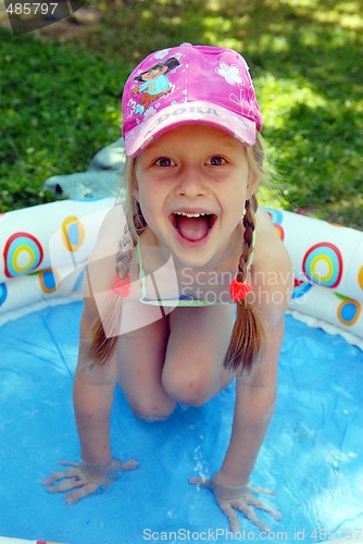 Image of A girl in the children pool