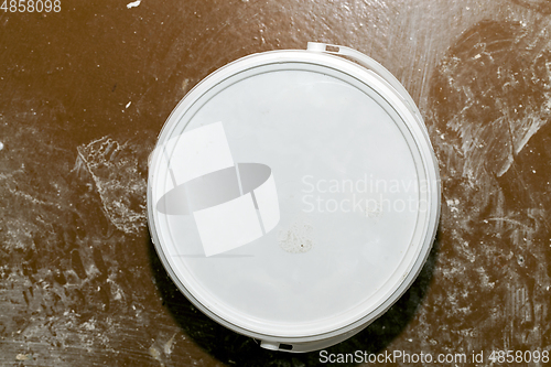 Image of white can with paint repair