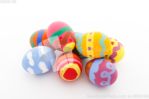 Image of Child painted Easter egg on white background