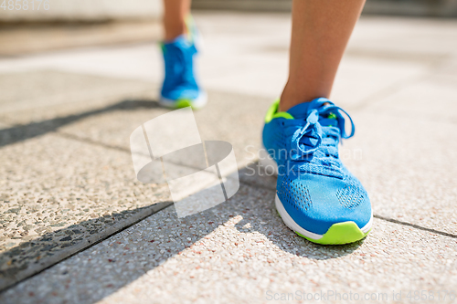 Image of Woman jogging in a city