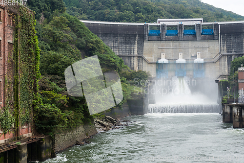 Image of Water rushing through gates at a dam