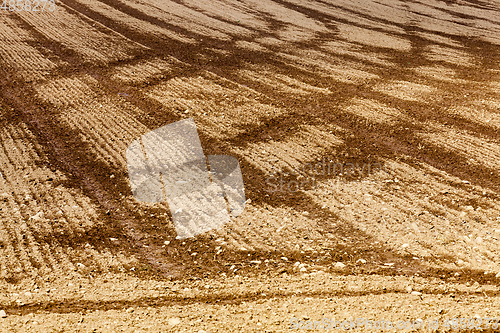 Image of plowed field and trail traces