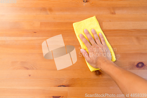 Image of Top view of hand cleaning table with yellow cloth 