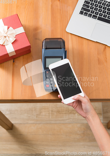Image of Pay with cellphone on POS machine for present