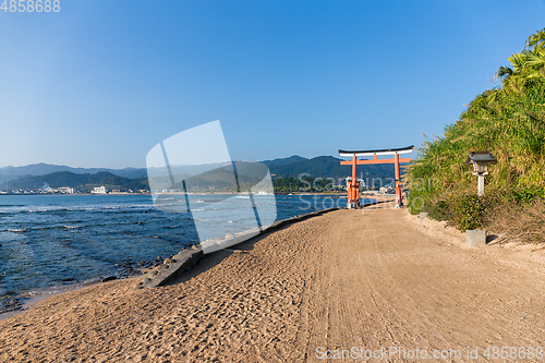 Image of Red Torii in Aoshima Shrine with sunshine