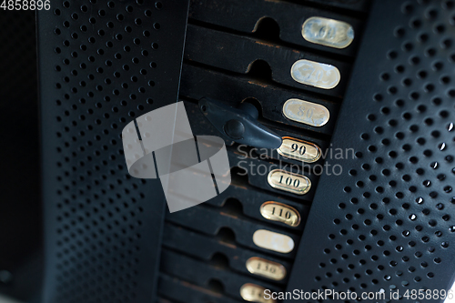 Image of Stack of metal weights in gym bodybuilding equipment