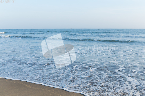 Image of Blue ocean on sandy beach