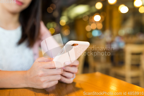 Image of Woman using mobile phone