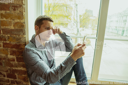 Image of Man working from home during coronavirus or COVID-19 quarantine, remote office concept