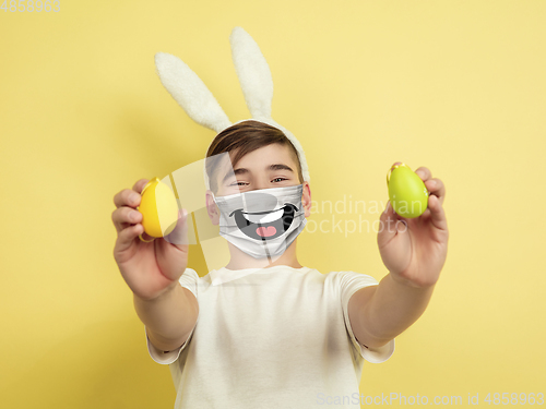 Image of Portrait of young caucasian boy with emotion on his protective face mask