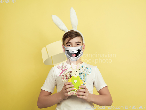 Image of Portrait of young caucasian boy with emotion on his protective face mask