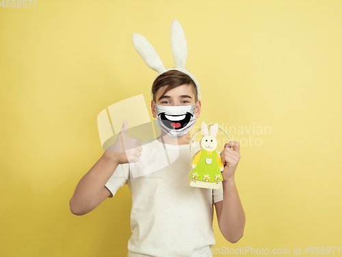 Image of Portrait of young caucasian boy with emotion on his protective face mask
