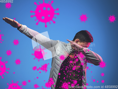Image of How to sneezing right - caucasian man dabbing in neon, stop epidemic