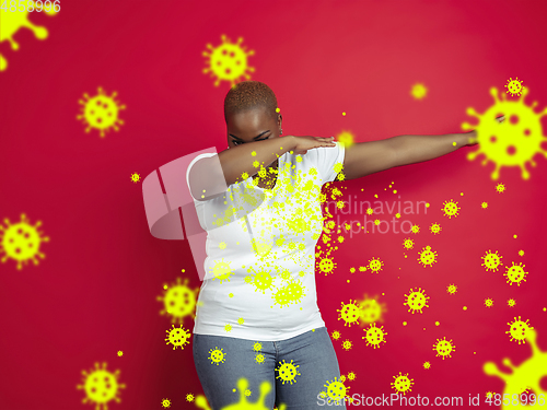 Image of How to sneezing right - african-american woman dabbing, stop epidemic