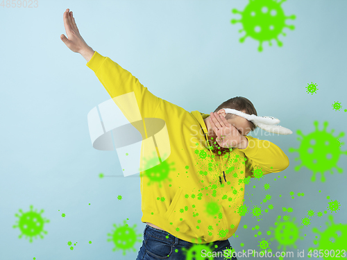 Image of How to sneezing right - caucasian man dabbing, stop epidemic