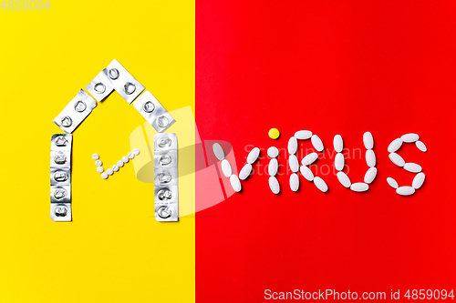 Image of Colored pills, tablets and capsules on a red and yellow background - history of treatment, prevention of pandemic