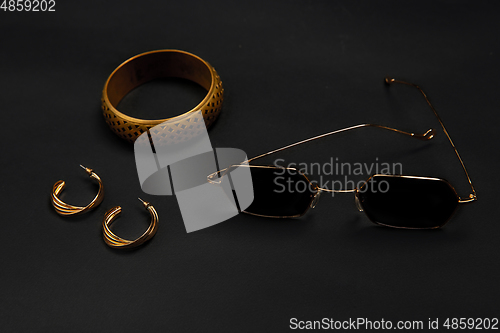 Image of Fashion look. Monochrome stylish composition in black and gold colors. Top view, flat lay.