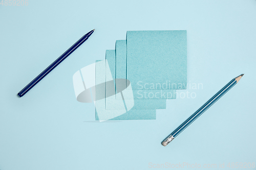 Image of Sticker paper. Monochrome stylish composition in blue color. Top view, flat lay.