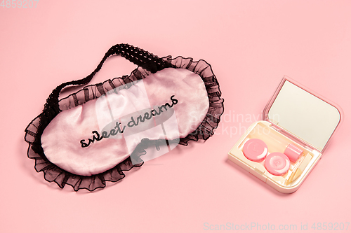 Image of Sweet dreams. Monochrome stylish composition in pink color. Top view, flat lay.