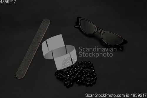 Image of Fashion look. Monochrome stylish composition in black color. Top view, flat lay.