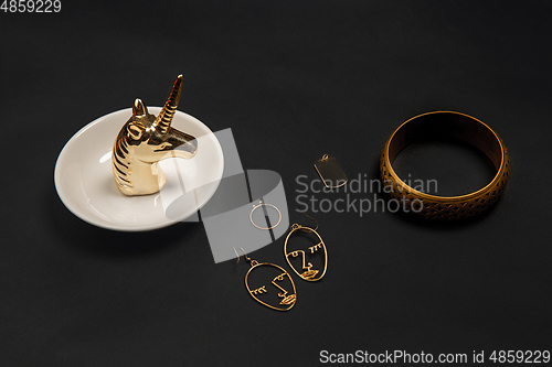 Image of Fashion look. Monochrome stylish composition in black and gold colors. Top view, flat lay.