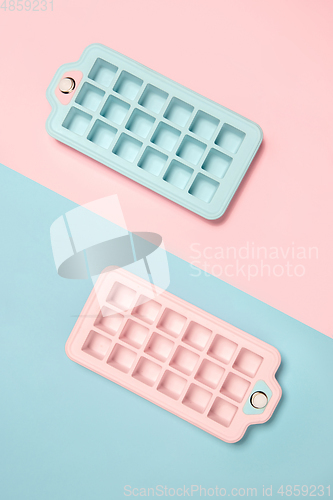Image of Ice forms. Monochrome stylish composition in blue and pink colors. Top view, flat lay.