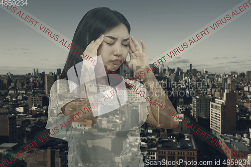 Image of Stressed woman holding head with hands on abstract city background. Double exposure. Virus alert, coronavirus pandemic.