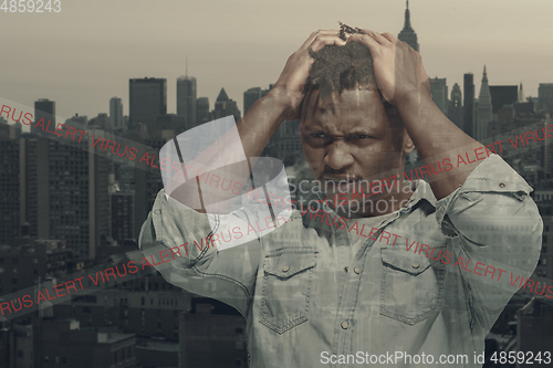 Image of Stressed man holding head with hands on abstract city background. Double exposure. Virus alert, coronavirus pandemic.