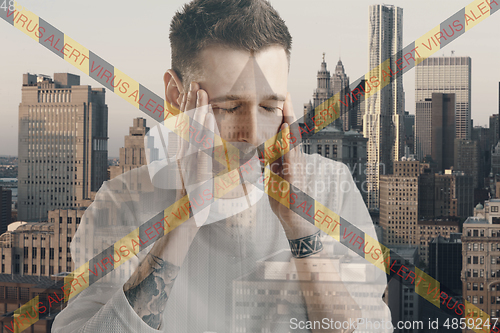 Image of Stressed man holding head with hands on abstract city background. Double exposure. Virus alert, coronavirus pandemic.