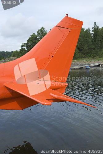 Image of Tailplane of orange seaplane