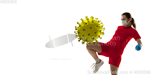 Image of Sportswoman kicking, punching coronavirus, protection and treatment concept, flyer