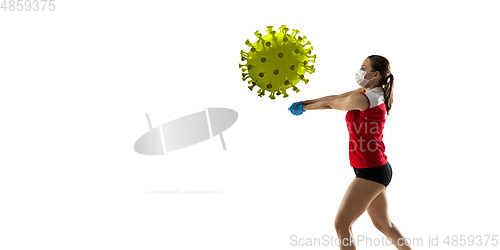 Image of Sportswoman kicking, punching coronavirus, protection and treatment concept, flyer