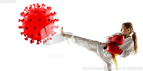 Image of Sportsgirl kicking, punching coronavirus, protection and treatment concept, flyer