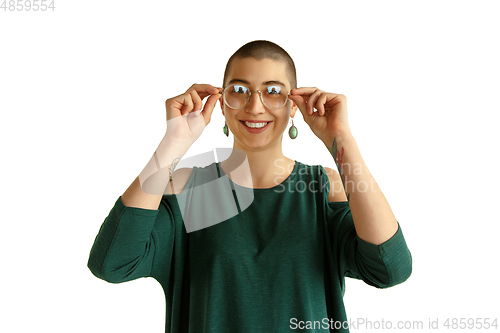 Image of Portrait of young woman with freaky appearance on white background