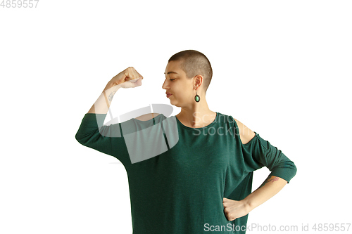 Image of Portrait of young woman with freaky appearance on white background