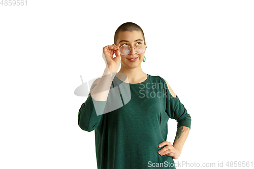 Image of Portrait of young woman with freaky appearance on white background