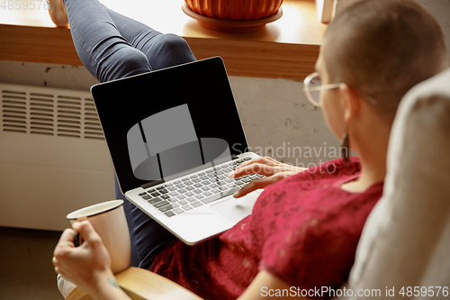 Image of Woman working from home during coronavirus or COVID-19 quarantine, remote office concept