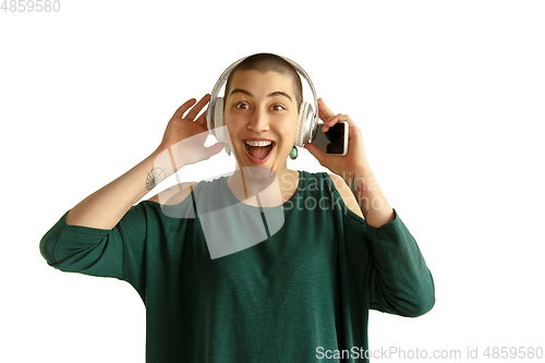 Image of Portrait of young woman with freaky appearance on white background