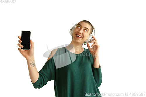 Image of Portrait of young woman with freaky appearance on white background