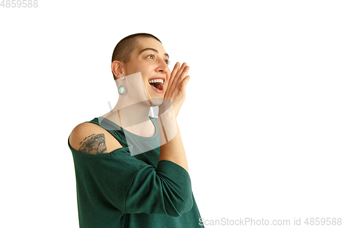 Image of Portrait of young woman with freaky appearance on white background