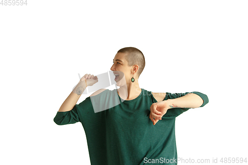 Image of Portrait of young woman with freaky appearance on white background