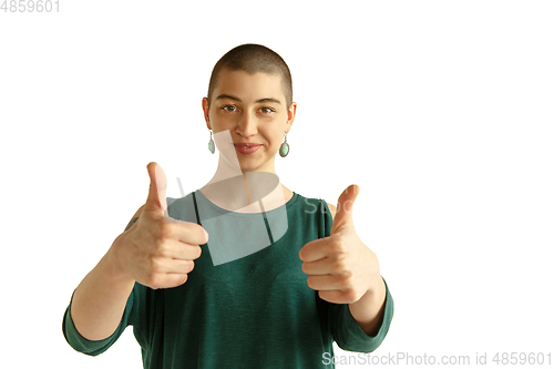 Image of Portrait of young woman with freaky appearance on white background