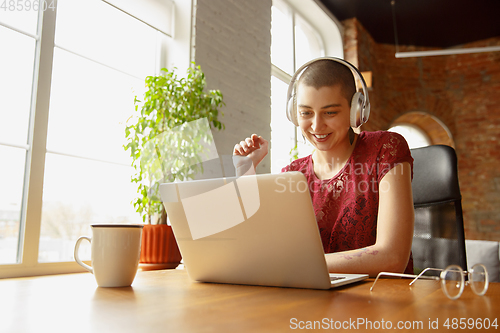 Image of Woman working from home during coronavirus or COVID-19 quarantine, remote office concept