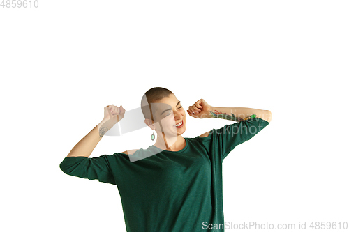 Image of Portrait of young woman with freaky appearance on white background