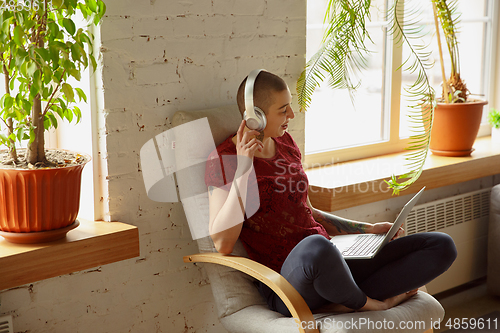 Image of Woman working from home during coronavirus or COVID-19 quarantine, remote office concept