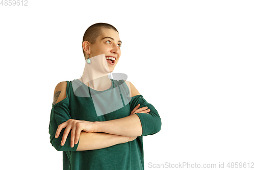 Image of Portrait of young woman with freaky appearance on white background