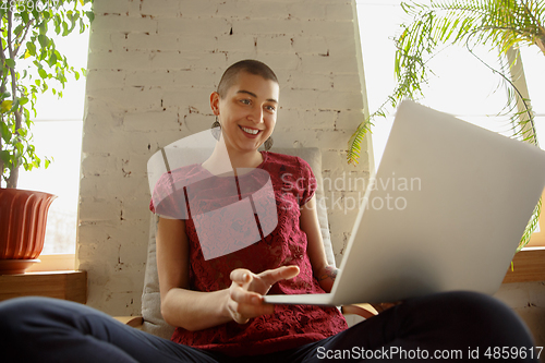 Image of Woman working from home during coronavirus or COVID-19 quarantine, remote office concept