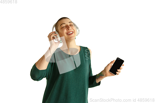 Image of Portrait of young woman with freaky appearance on white background