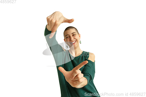 Image of Portrait of young woman with freaky appearance on white background